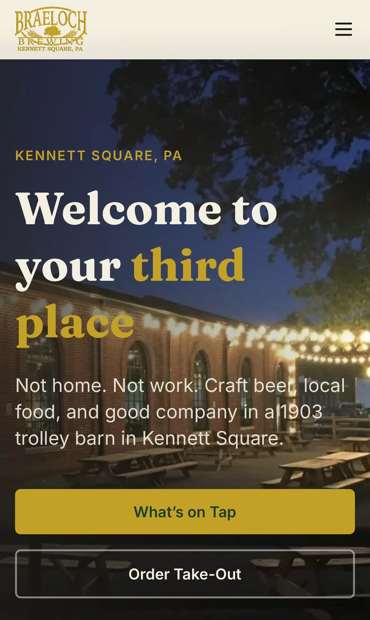 Modernized Braeloch Brewing website: 'Welcome to your third place' hero over the string-lit 1903 trolley barn, with What's on Tap and Order Take-Out actions